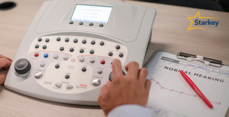 Image of a hearing care professional performing a hearing test